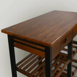 28" Solid Wood Rolling Kitchen Cart With Wine Rack And Drawer Dark Brown - Flora Home -Baxton Home Shop GUEST a9346ccf 4dd2 4077 8c83 2c9a207ed755